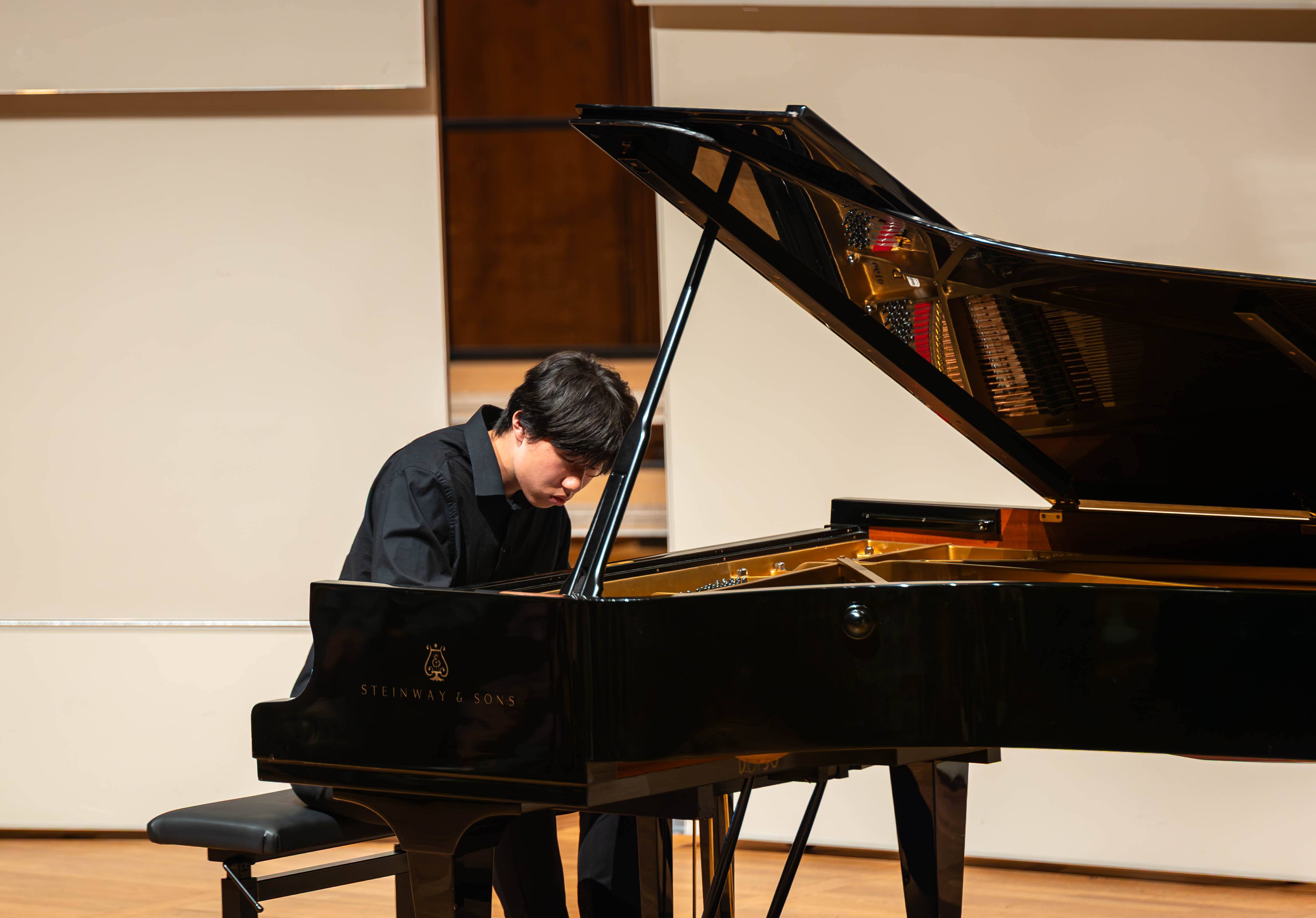 Zhifan Yin leaning into a piano performance